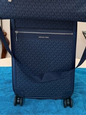 Michael Kors Navy Monogram Spinner luggage bag